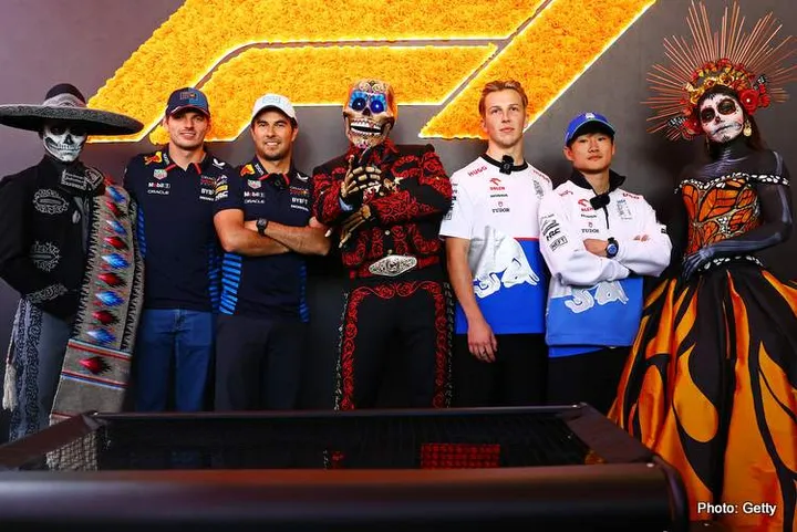 MEXICO CITY, MEXICO - OCTOBER 24: Max Verstappen of the Netherlands and Oracle Red Bull Racing, Sergio Perez of Mexico and Oracle Red Bull Racing, Liam Lawson of New Zealand and Visa Cash App RB and Yuki Tsunoda of Japan and Visa Cash App RB pose for a photo with Day of the Dead performers in the Paddock during previews ahead of the F1 Grand Prix of Mexico at Autodromo Hermanos Rodriguez on October 24, 2024 in Mexico City, Mexico. (Photo by Mark Thompson/Getty Images) // Getty Images / Red Bull Content Pool // SI202410240503 // Usage for editorial use only //