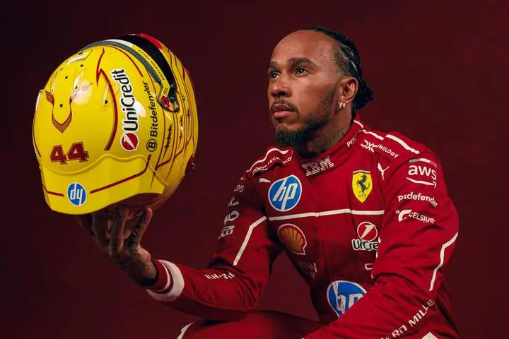 Lewis-Hamilton-2025-red-background-04_e3ef9655-82c3-4ece-98c1-a1c023dc02c3