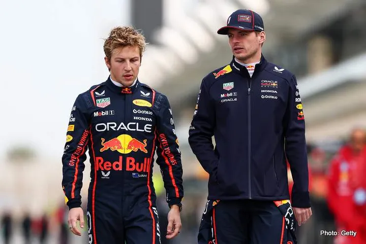 BAHRAIN, BAHRAIN - FEBRUARY 26: Liam Lawson of New Zealand and Oracle Red Bull Racing and Max Verstappen of the Netherlands and Oracle Red Bull Racing talk as they walk in the Pitlane during day one of F1 Testing at Bahrain International Circuit on February 26, 2025 in Bahrain, Bahrain. (Photo by Clive Rose/Getty Images) // Getty Images / Red Bull Content Pool // SI202502260039 // Usage for editorial use only //
