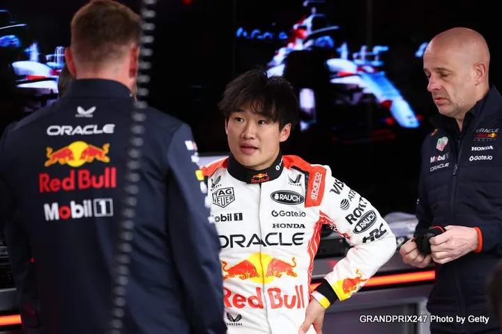 Yuki Tsunoda of Japan and Oracle Red Bull Racing talks with his teammates in the garage during previews ahead of the F1 Grand Prix of Japan at Suzuka Circuit on April 03, 2025 in Suzuka, Japan