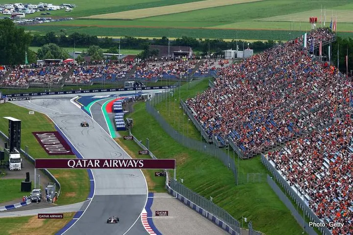 SPIELBERG, AUSTRIA - JUNE 27: Esteban Ocon of France driving the (31) Haas F1 VF-25 Ferrari leads Yuki Tsunoda of Japan driving the (22) Oracle Red Bull Racing RB21 on track during practice ahead of the F1 Grand Prix of Austria at Red Bull Ring on June 27, 2025 in Spielberg, Austria. (Photo by Joe Portlock/Getty Images) // Getty Images / Red Bull Content Pool // SI202506270826 // Usage for editorial use only //