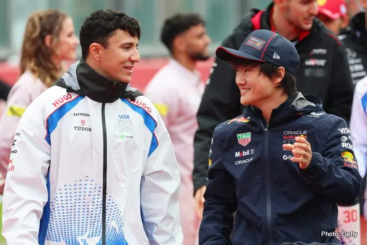 SPA, BELGIUM - JULY 27: Isack Hadjar of France and Visa Cash App Racing Bulls and Yuki Tsunoda of Japan and Oracle Red Bull Racing talk on the drivers parade prior to the F1 Grand Prix of Belgium at Circuit de Spa-Francorchamps on July 27, 2025 in Spa, Belgium. (Photo by Mark Thompson/Getty Images) // Getty Images / Red Bull Content Pool // SI202507270967 // Usage for editorial use only //