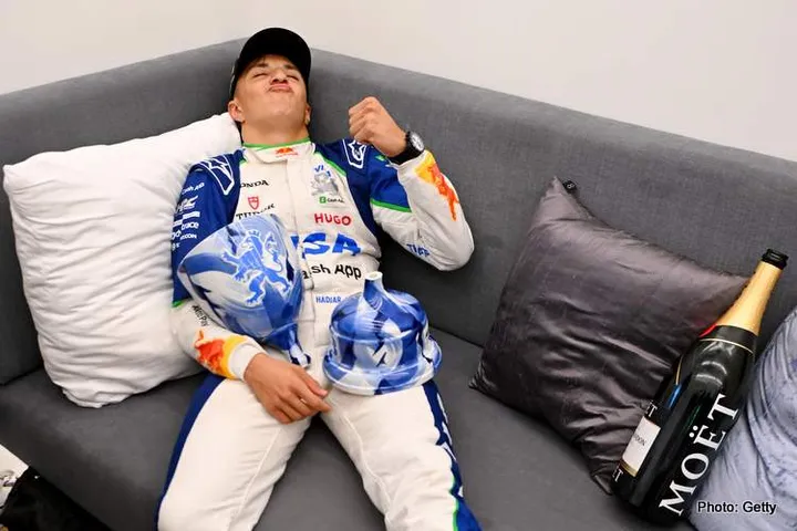 ZANDVOORT, NETHERLANDS - AUGUST 31: Third placed Isack Hadjar of France and Visa Cash App Racing Bulls celebrates with his broken trophy during the F1 Grand Prix of Netherlands at Circuit Zandvoort on August 31, 2025 in Zandvoort, Netherlands. (Photo by Rudy Carezzevoli/Getty Images) // Getty Images / Red Bull Content Pool // SI202509010210 // Usage for editorial use only //