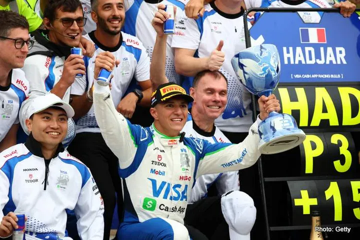 ZANDVOORT, NETHERLANDS - AUGUST 31: Third placed Isack Hadjar of France and Visa Cash App Racing Bulls, celebrates with his team during the F1 Grand Prix of Netherlands at Circuit Zandvoort on August 31, 2025 in Zandvoort, Netherlands. (Photo by Clive Rose/Getty Images) // Getty Images / Red Bull Content Pool // SI202509011077 // Usage for editorial use only //