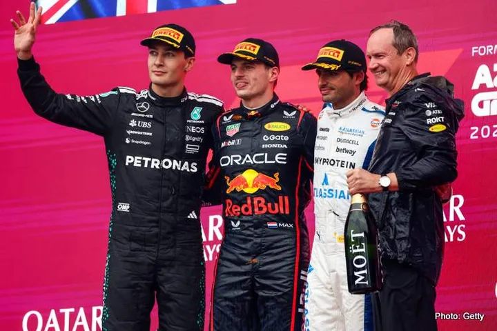 BAKU, AZERBAIJAN - SEPTEMBER 21: Race winner Max Verstappen of the Netherlands and Oracle Red Bull Racing Second placed George Russell of Great Britain and Mercedes AMG Petronas F1 Team Third placed Carlos Sainz of Spain and Williams and Paul Monaghan, Head of Car Engineering of Oracle Red Bull Racing on the podium during the F1 Grand Prix of Azerbaijan at Baku City Circuit on September 21, 2025 in Baku, Azerbaijan. (Photo by Andy Hone/LAT Images) // Getty Images / Red Bull Content Pool // SI202509210411 // Usage for editorial use only //
