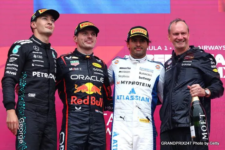 BAKU, AZERBAIJAN - SEPTEMBER 21: Race winner Max Verstappen of the Netherlands and Oracle Red Bull Racing Second placed George Russell of Great Britain and Mercedes AMG Petronas F1 Team Third placed Carlos Sainz of Spain and Williams and Paul Monaghan, Head of Car Engineering of Oracle Red Bull Racing on the podium during the F1 Grand Prix of Azerbaijan at Baku City Circuit on September 21, 2025 in Baku, Azerbaijan. (Photo by Andrew Ferraro/LAT Images) // Getty Images / Red Bull Content Pool // SI202509210492 // Usage for editorial use only //