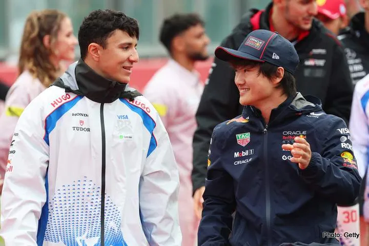 SPA, BELGIUM - JULY 27: Isack Hadjar of France and Visa Cash App Racing Bulls and Yuki Tsunoda of Japan and Oracle Red Bull Racing talk on the drivers parade prior to the F1 Grand Prix of Belgium at Circuit de Spa-Francorchamps on July 27, 2025 in Spa, Belgium. (Photo by Mark Thompson/Getty Images) // Getty Images / Red Bull Content Pool // SI202507270966 // Usage for editorial use only //