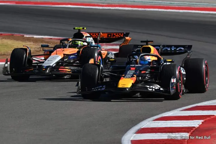 AUSTIN, TEXAS - OCTOBER 19: Race winner Max Verstappen of the Netherlands driving the (1) Oracle Red Bull Racing RB21and Second placed Lando Norris of Great Britain driving the (4) McLaren MCL39 Mercedes on the slowdown lap during the F1 Grand Prix of United States at Circuit of The Americas on October 19, 2025 in Austin, Texas. (Photo by Clive Mason/Getty Images) // Getty Images / Red Bull Content Pool // SI202510191384 // Usage for editorial use only //