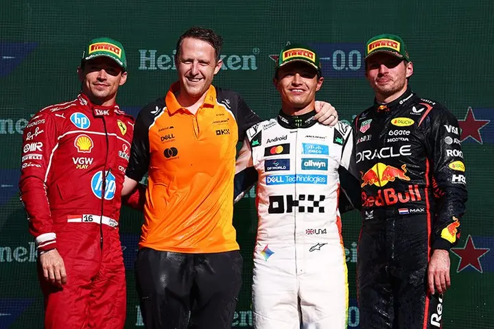 MEXICO CITY, MEXICO - OCTOBER 26: Race winner Lando Norris of Great Britain and McLaren Second placed Charles Leclerc of Monaco and Scuderia Ferrari Third placed Max Verstappen of the Netherlands and Oracle Red Bull Racing and the McLaren trophy delegate on the podium during the F1 Grand Prix of Mexico at Autodromo Hermanos Rodriguez on October 26, 2025 in Mexico City, Mexico. (Photo by Clive Rose/Getty Images) // Getty Images / Red Bull Content Pool // SI202510260881 // Usage for editorial use only //