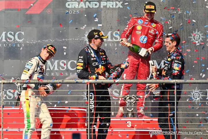 AUSTIN, TEXAS - OCTOBER 19: Race winner Max Verstappen of the Netherlands and Oracle Red Bull Racing Second placed Lando Norris of Great Britain and McLaren Third placed Charles Leclerc of Monaco and Scuderia Ferrari and Chris Gent, Chief Mechanic at Oracle Red Bull Racing on the podium during the F1 Grand Prix of United States at Circuit of The Americas on October 19, 2025 in Austin, Texas. (Photo by Michael Potts/LAT Images) // Getty Images / Red Bull Content Pool // SI202510200010 // Usage for editorial use only //
