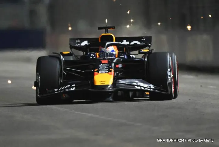 SINGAPORE, SINGAPORE - OCTOBER 05: Sparks fly behind Max Verstappen of the Netherlands and Oracle Red Bull Racing on track during the F1 Grand Prix of Singapore at Marina Bay Street Circuit on October 05, 2025 in Singapore, Singapore. (Photo by Clive Mason/Getty Images) // Getty Images / Red Bull Content Pool // SI202510050993 // Usage for editorial use only //