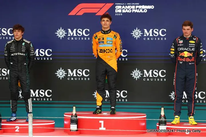 SAO PAULO, BRAZIL - NOVEMBER 09: Race winner Lando Norris of Great Britain and McLaren Second placed Andrea Kimi Antonelli of Italy and Mercedes AMG Petronas F1 Team and Third placed Max Verstappen of the Netherlands and Oracle Red Bull Racing on the podium during the F1 Grand Prix of Brazil at Autodromo Jose Carlos Pace on November 09, 2025 in Sao Paulo, Brazil. (Photo by Zak Mauger/LAT Images) // Getty Images / Red Bull Content Pool // SI202511090721 // Usage for editorial use only //