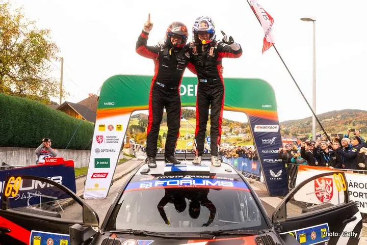 Kalle Rovanperä (FIN) Jonne Halttunen (FIN) Of Toyota Gazoo Racing Wrt celebrate on the podium in first place after winning the World Rally Championship in Passau, Germany on 19.10.2025 // Jaanus Ree / Red Bull Content Pool // SI202510190938 // Usage for editorial use only //