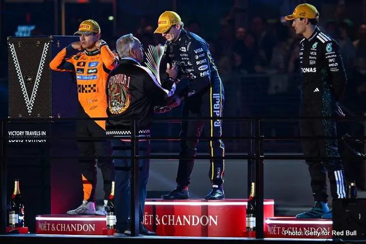 LAS VEGAS, NEVADA - NOVEMBER 22: Race winner Max Verstappen of the Netherlands and Oracle Red Bull Racing receives his trophy on the podium during the F1 Grand Prix of Las Vegas at Las Vegas Strip Circuit on November 22, 2025 in Las Vegas, Nevada. (Photo by Guido De Bortoli/LAT Images) // Getty Images / Red Bull Content Pool // SI202511230546 // Usage for editorial use only //