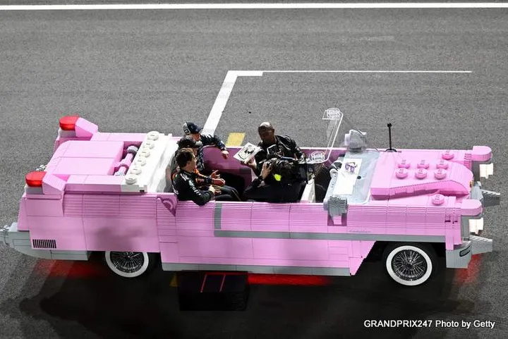 LAS VEGAS, NEVADA - NOVEMBER 22: Race winner Max Verstappen of the Netherlands and Oracle Red Bull Racing Second placed Lando Norris of Great Britain and McLaren and Third placed George Russell of Great Britain and Mercedes AMG Petronas F1 Team are driven in a Lego pink Cadillac by Terry Crews during the F1 Grand Prix of Las Vegas at Las Vegas Strip Circuit on November 22, 2025 in Las Vegas, Nevada. (Photo by Sam Bagnall/Sutton Images) // Getty Images / Red Bull Content Pool // SI202511230359 // Usage for editorial use only //