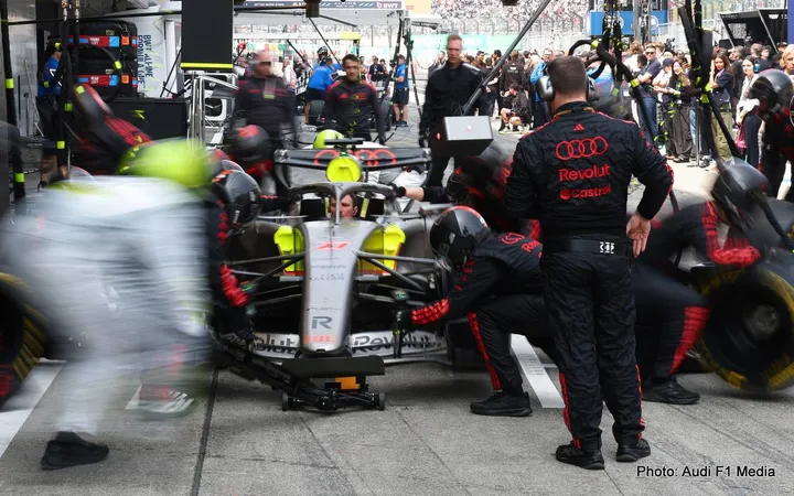 SUZUKA, JAPAN - MARCH 29: The Audi F1 Team pit crew practice a pit stop in the Pitlane prior to the F1 Grand Prix of Japan at Suzuka Circuit on March 29, 2026 in Suzuka, Japan. (Photo by Andy Hone/LAT Images)