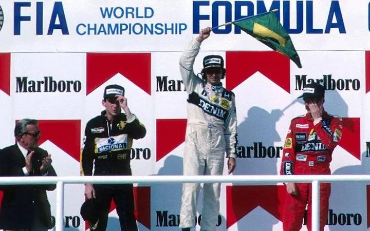 Podium and Results: first Nelson Piquet (BRA) Williams middle, second Ayrton Senna (BRA) Lotus left and third Nigel Mansell (GBR) Williams right. Hungarian Grand Prix, Hungaroring, Budapest, Hungary, 10 August 1986.