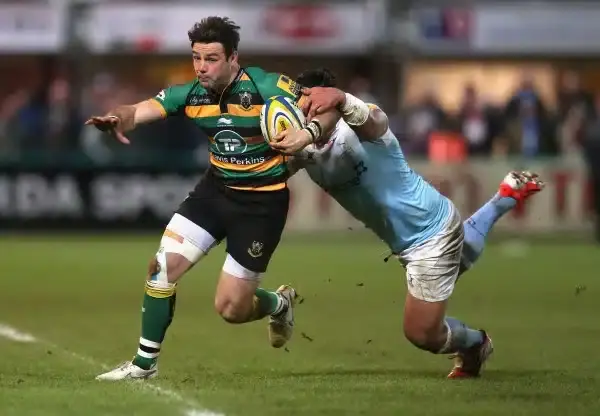 NORTHAMPTON, ENGLAND - JANUARY 02: Ben Foden of Northampton is tackled by Anitelea Tuilagi during the Aviva Premiership match between Northampton Saints and Newcastle Falcons at Franklin's Gardens on January 2, 2015 in Northampton, England. (Photo by Davi