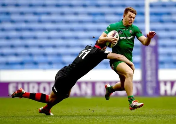 READING, ENGLAND - APRIL 05: Alex Lewington of London Irish is tackled by Tim Visser of Edinburgh during the European Rugby Challenge Cup Quarter Final between London Irish and Edinburgh Rugby at the Madejski Stadium on April 5, 2015 in Reading, England. 