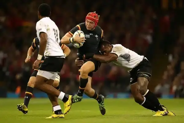 CARDIFF, WALES - OCTOBER 01: Tyler Morgan of Wales is tackled by Vereniki Goneva of Fiji during the 2015 Rugby World Cup Pool A match between Wales and Fiji at Millennium Stadium on October 1, 2015 in Cardiff, United Kingdom. (Photo by Jan Hendrik Kruger/