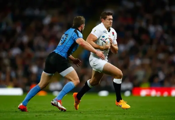 MANCHESTER, ENGLAND - OCTOBER 10: Alex Goode of England is tackled by Felipe Berchesi of Uruguay during the 2015 Rugby World Cup Pool A match between England and Uruguay at Manchester City Stadium on October 10, 2015 in Manchester, United Kingdom. (Photo 
