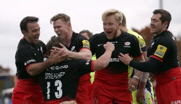 BARNET, ENGLAND - OCTOBER 17: Tim Streather (No 13) of Saracens celebrates with his team-mates after he scores a try for his side during the Aviva Premiership match between Saracens and Sale Sharks at Allianz Park on October 17, 2015 in Barnet, England. (