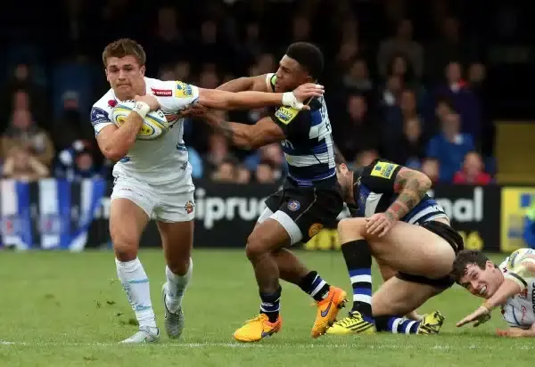 BATH, ENGLAND - OCTOBER 17: Henry Slade of Exeter Chiefs breaks the tackle by Kyle Eastmond of Bath Rugby during the Aviva Premiership match between Bath Rugby and Exeter Chiefs at the Recreation Ground on October 17, 2015 in Bath, England. (Photo by Davi