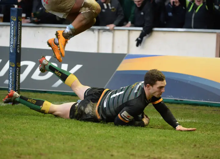 NORTHAMPTON, ENGLAND - JANUARY 24: George North of Northampton Saints dives in to score a try during the European Rugby Champions Cup match between Northampton Saints and Racing Metro 92 at Franklin's Gardens on January 24, 2015 in Northampton, England. (