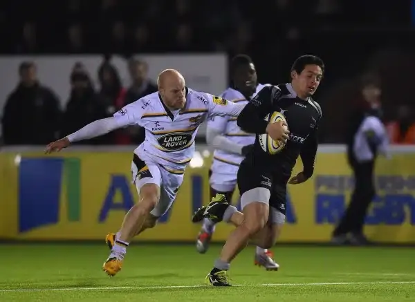 NEWCASTLE UPON TYNE, ENGLAND - FEBRUARY 20: Juan Pablo Socino of Newcastle breaks past Joe Simpson of Wasps to score a second half try during the Aviva Premiership match between Newcastle Falcons and Wasps at Kingston Park on February 20, 2015 in Newcastl