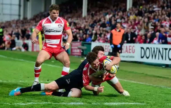 GLOUCESTER, ENGLAND - APRIL 25: Gloucester player Billy Burns goes over for the winning try during the Aviva Premiership match between Gloucester Rugby and Newcastle Falcons at Kingsholm Stadium on April 25, 2015 in Gloucester, England. (Photo by Stu Fors