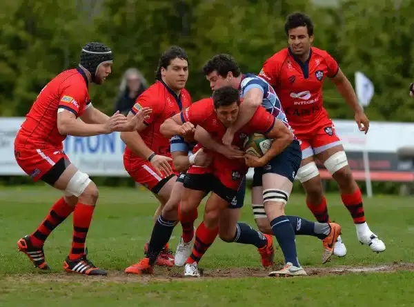 ROTHERHAM, ENGLAND - MAY 10: Alex Rieder of Rotherham Titans tackles Gavin Henson of Bristol during the Greene King IPA Championship Playoff Semi-Final match between Rotherham Titans and Bristol at the Abbeydale Sports Ground on May 10, 2015 in Rotherham,