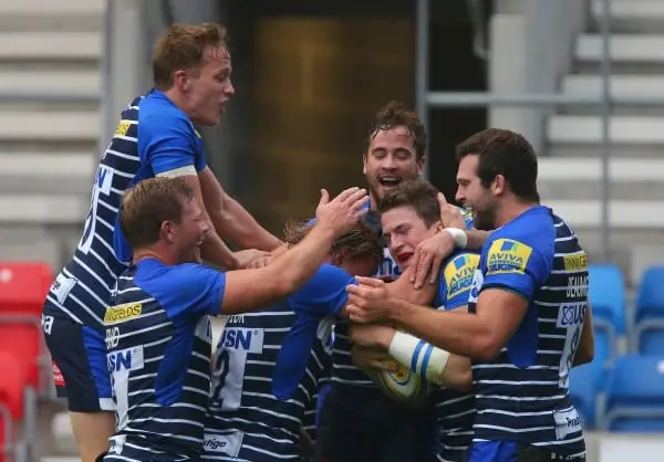 SALFORD, ENGLAND - NOVEMBER 1: Sale Sharks players congratulate Sam James, second from right, after he scored his side's first try of the match during the Aviva Premiership match between Sale Sharks and Northampton Saints at the AJ Bell Stadium on Novembe