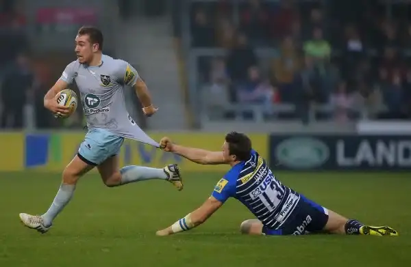 SALFORD, ENGLAND - NOVEMBER 1: JJ Hanrahan of Northampton Saints has his shirt pulled by Sam James of Sale Sharks during the Aviva Premiership match between Sale Sharks and Northampton Saints at the AJ Bell Stadium on November 1, 2015 in Salford, England.