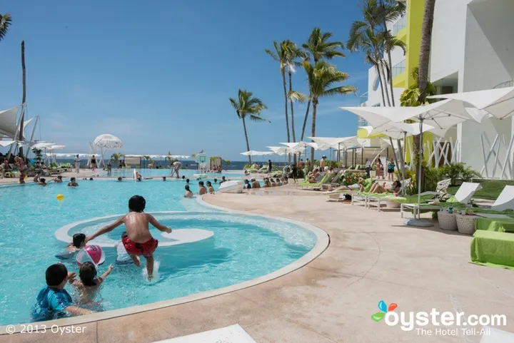 reality instead of an attractive lady and a quiet pool guests will find crowds kids and even aerobics classes