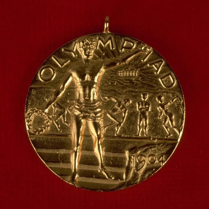 st louis 1904 the obverse shows a triumphant athlete in front of a bas relief illustrating the classic sports from antiquity