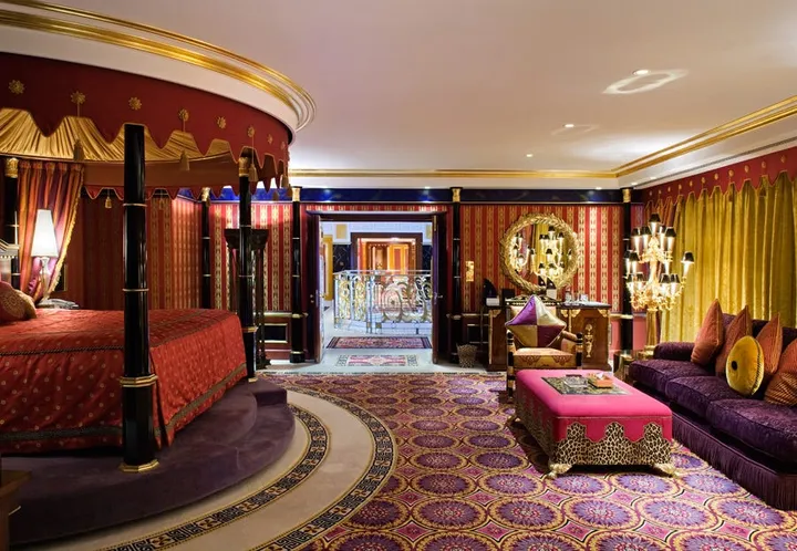 to the master bedroom with a rotating four poster canopy bed
